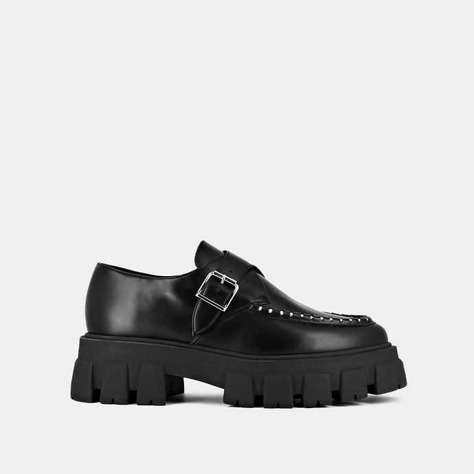 Mocassins à semelles crantées et détails...  en cuir glacé noir