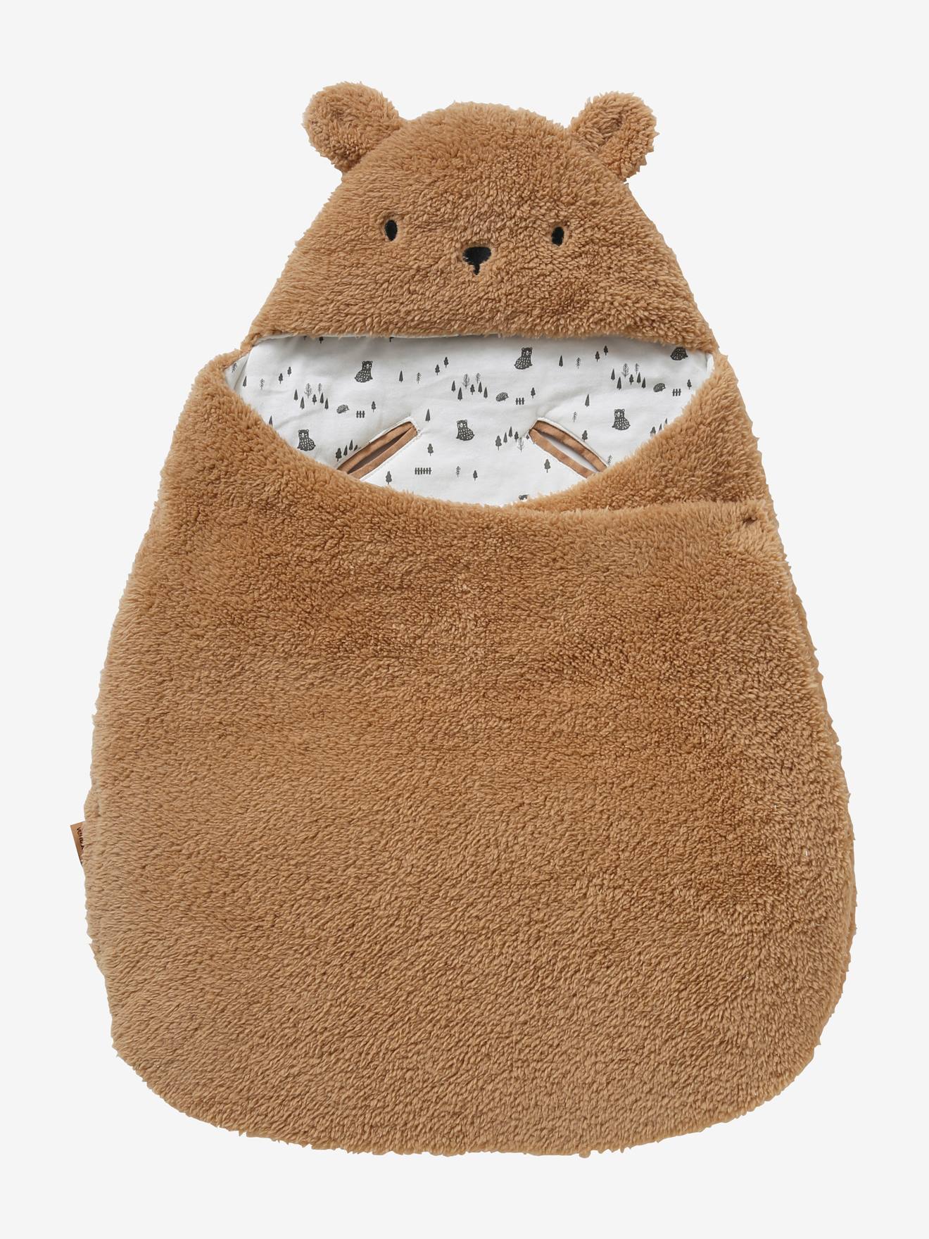 Saco transformável em brinquedo de pelúcia. Urso de pelúcia liso bege claro com estampas.