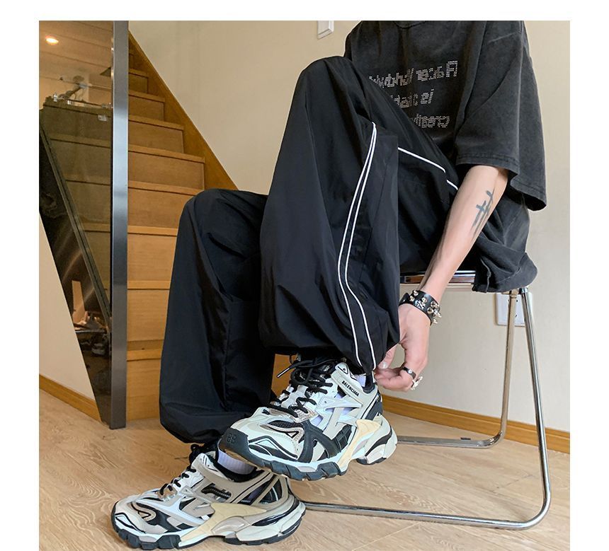 Posive - Gestreepte joggingbroek met wijde pijpen en trekkoordtaille