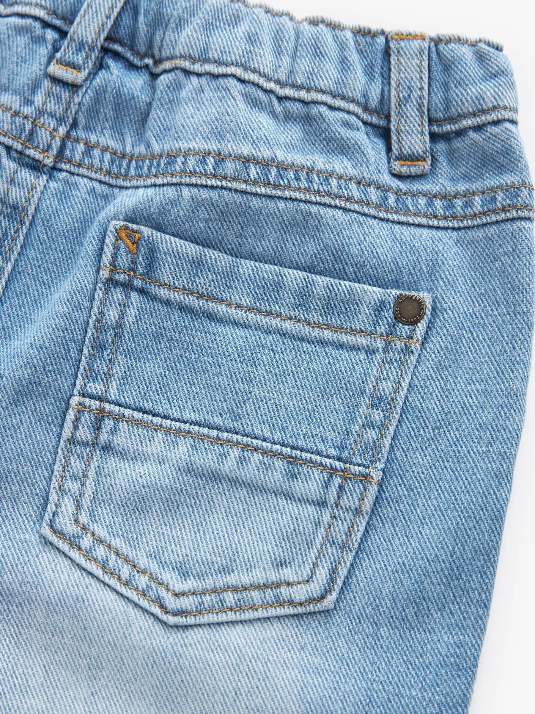 Lichtblauwe denim - Jeans met geplooide voorkant (3mnd-7jr)