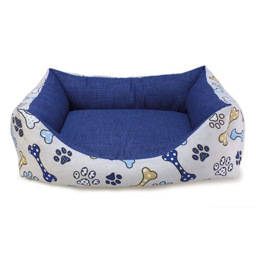 Cama azul para cachorro com ossos e pegadas.