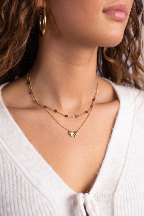 Ketting met munt en paarse kralen