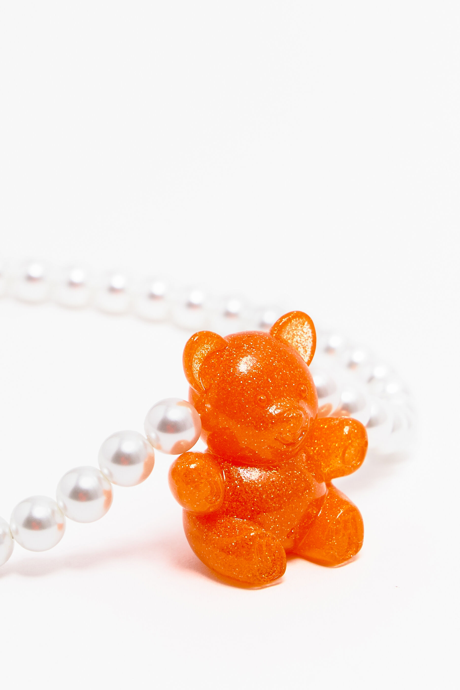 colar de pérolas em forma de urso laranja neon