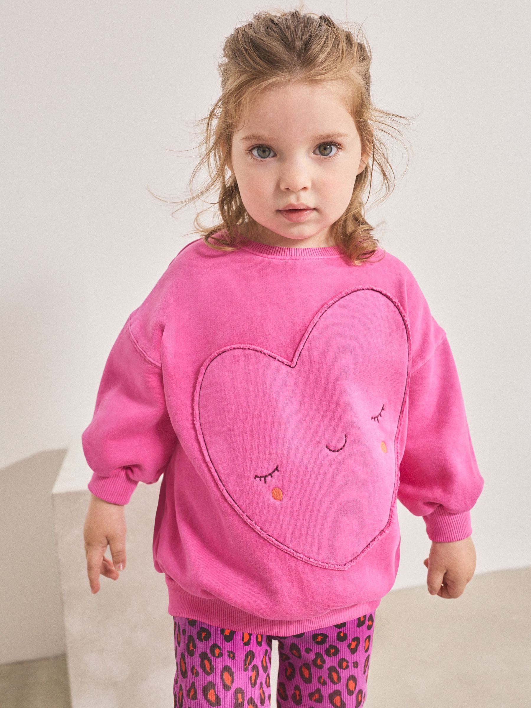 Roze dierenprint met hartjes - Set van sweatshirt en uitlopende legging (3mnd -7jr)
