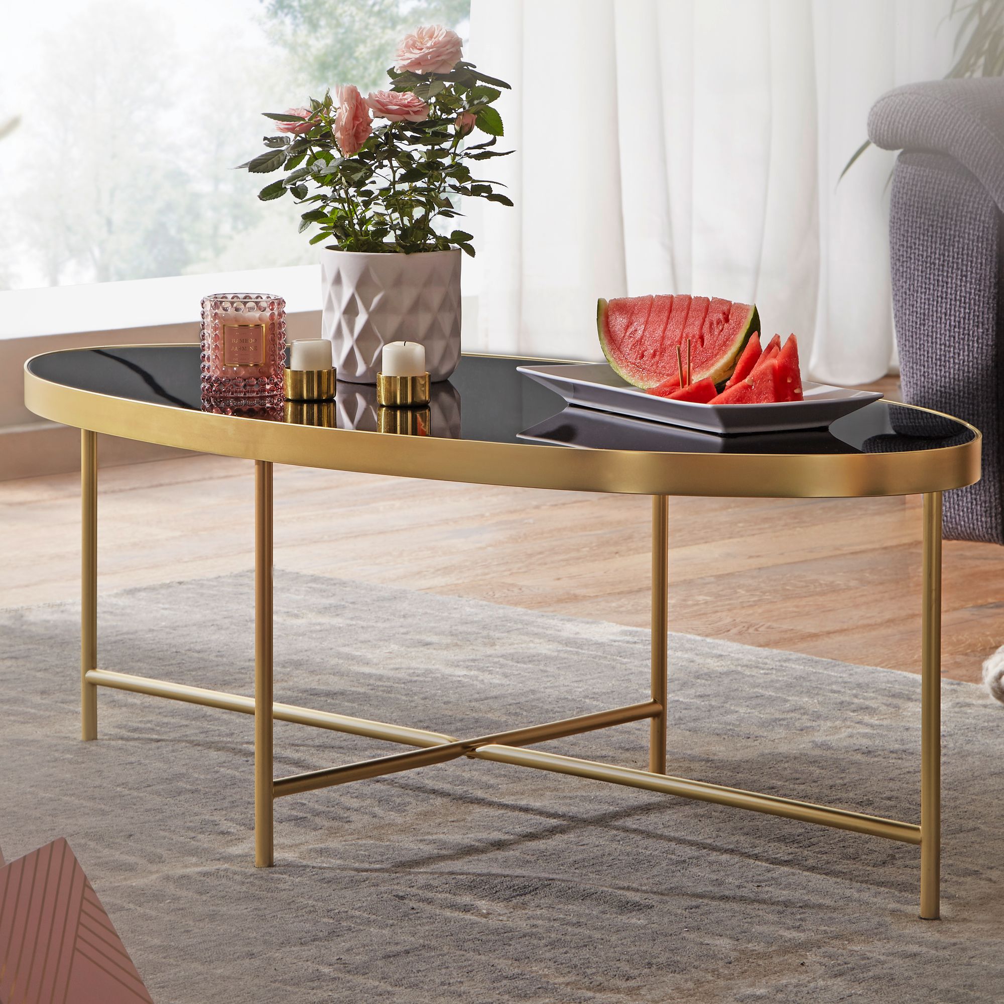 KADIMA DESIGN VILS Couchtisch, oval, Glasplatte, filigranes Metallgestell, Schwarz/Gold, 110x56 cm