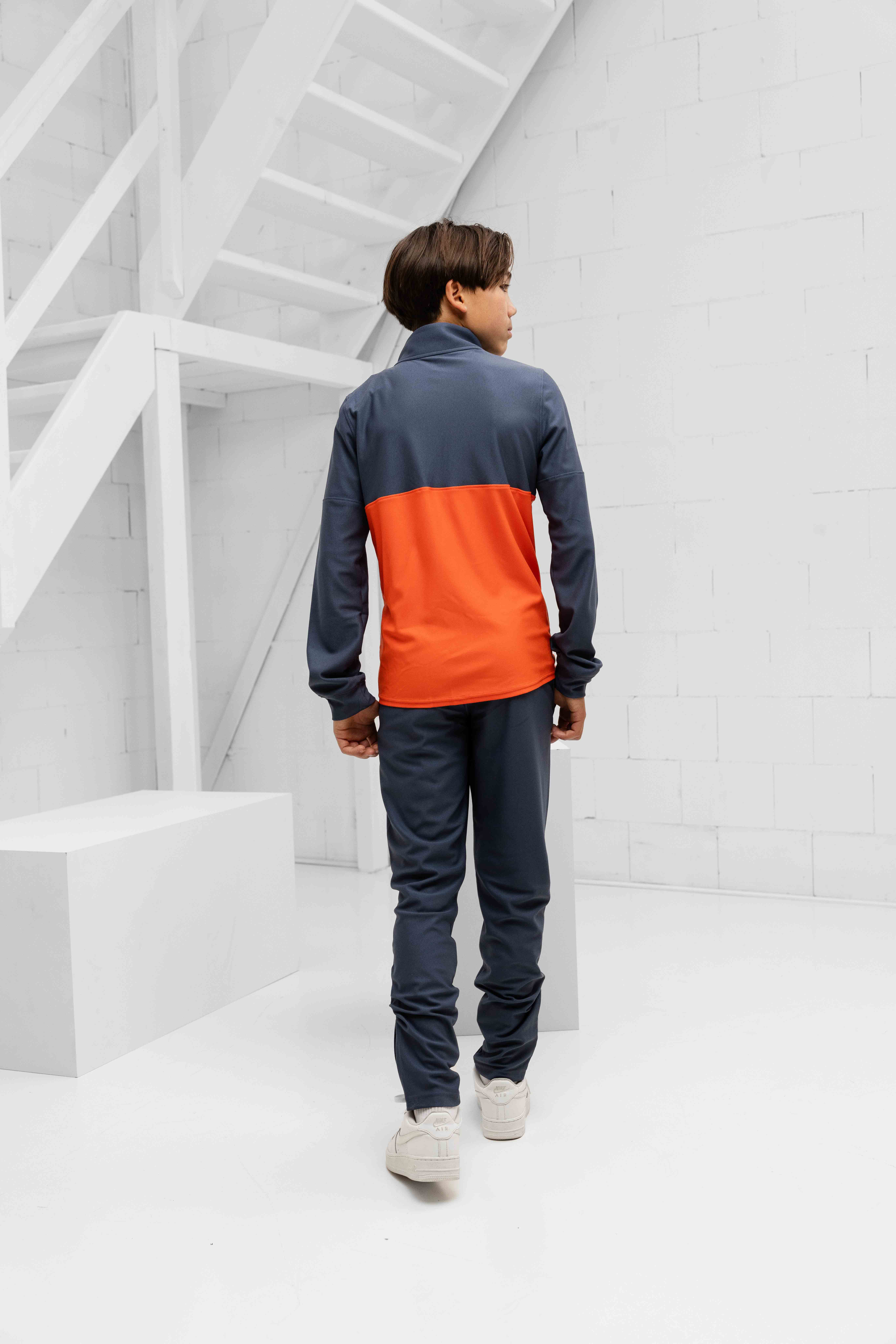 Under Armour Challenger Trainingspak Kids Donkergrijs/Oranje