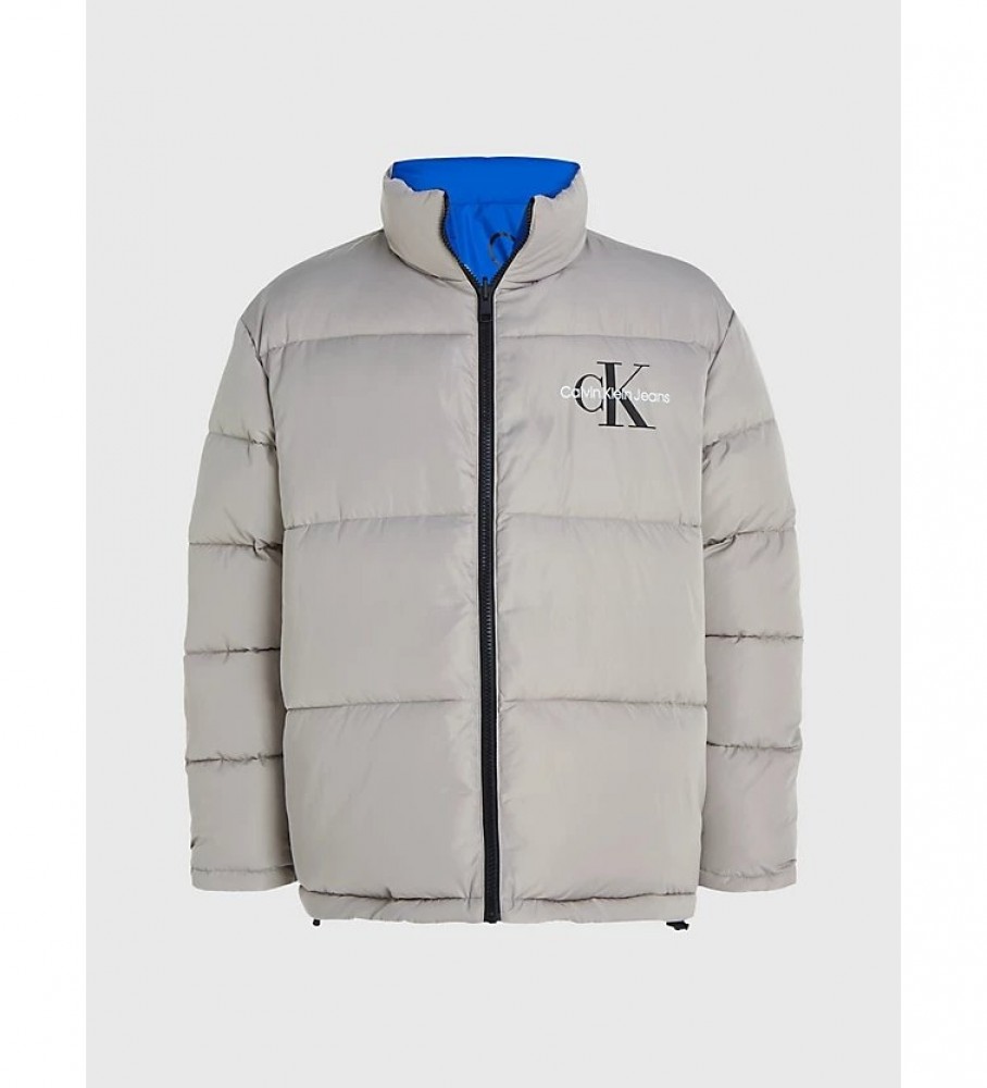 Jaqueta reversível de plumas Calvin Klein Jeans, azul e cinza, estilo anos 90.