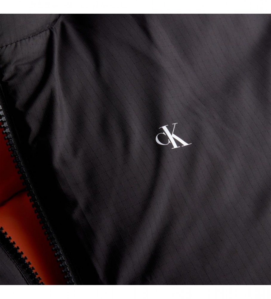 Jaqueta reversível de penas Calvin Klein Jeans anos 90 preta. Laranja