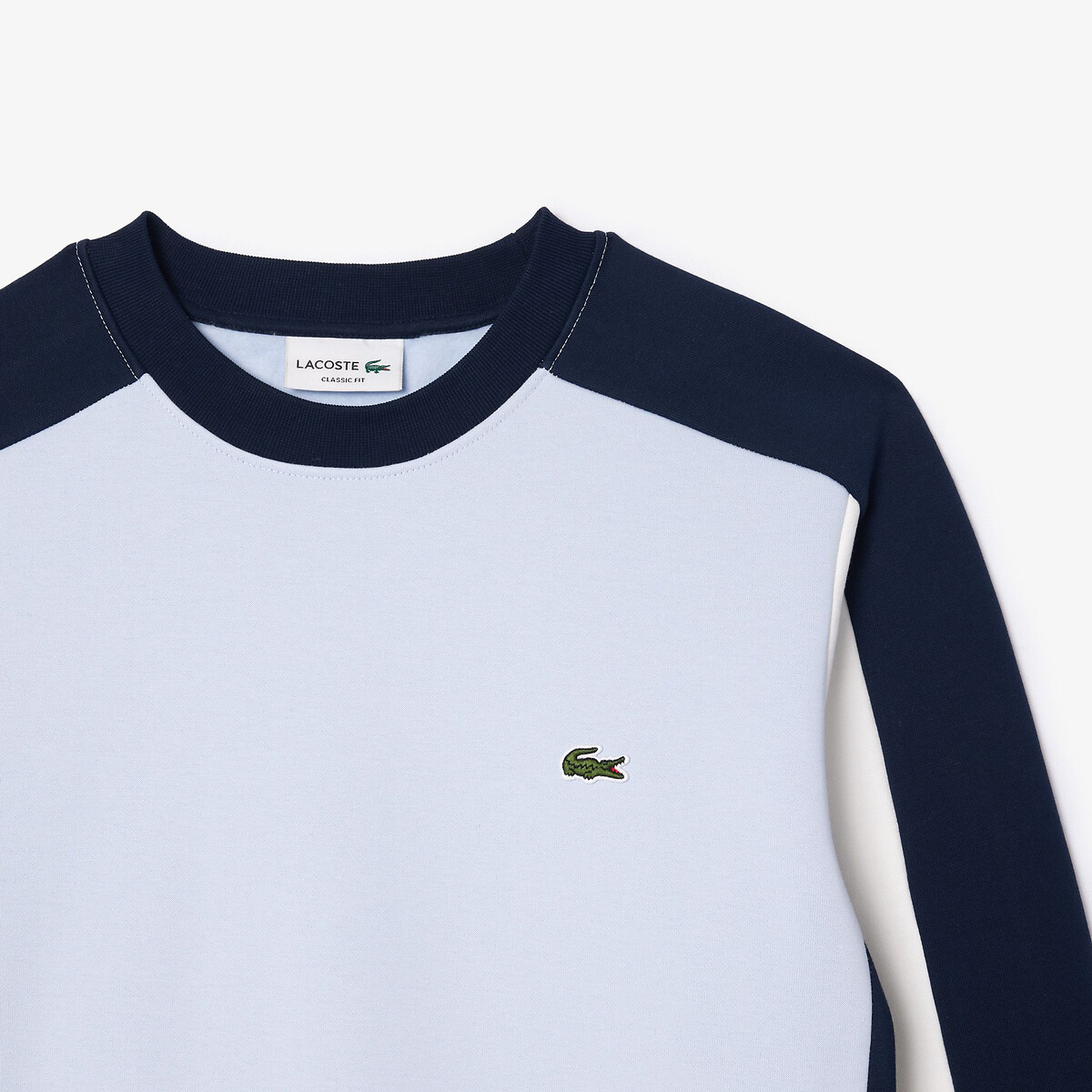 Suéter LACOSTE com gola redonda e blocos de cor, em fleece.