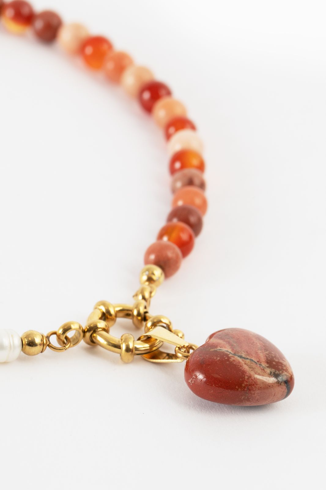 Oranje beads ketting met parels
