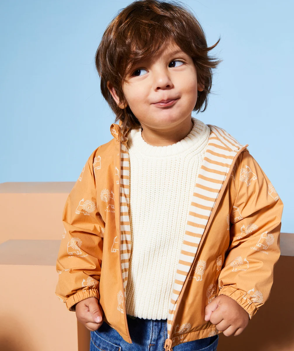 COUPE-VENT BÉBÉ GARÇON RÉVERSIBLE ORANGE IMPRIMÉ LION OU RAYÉ