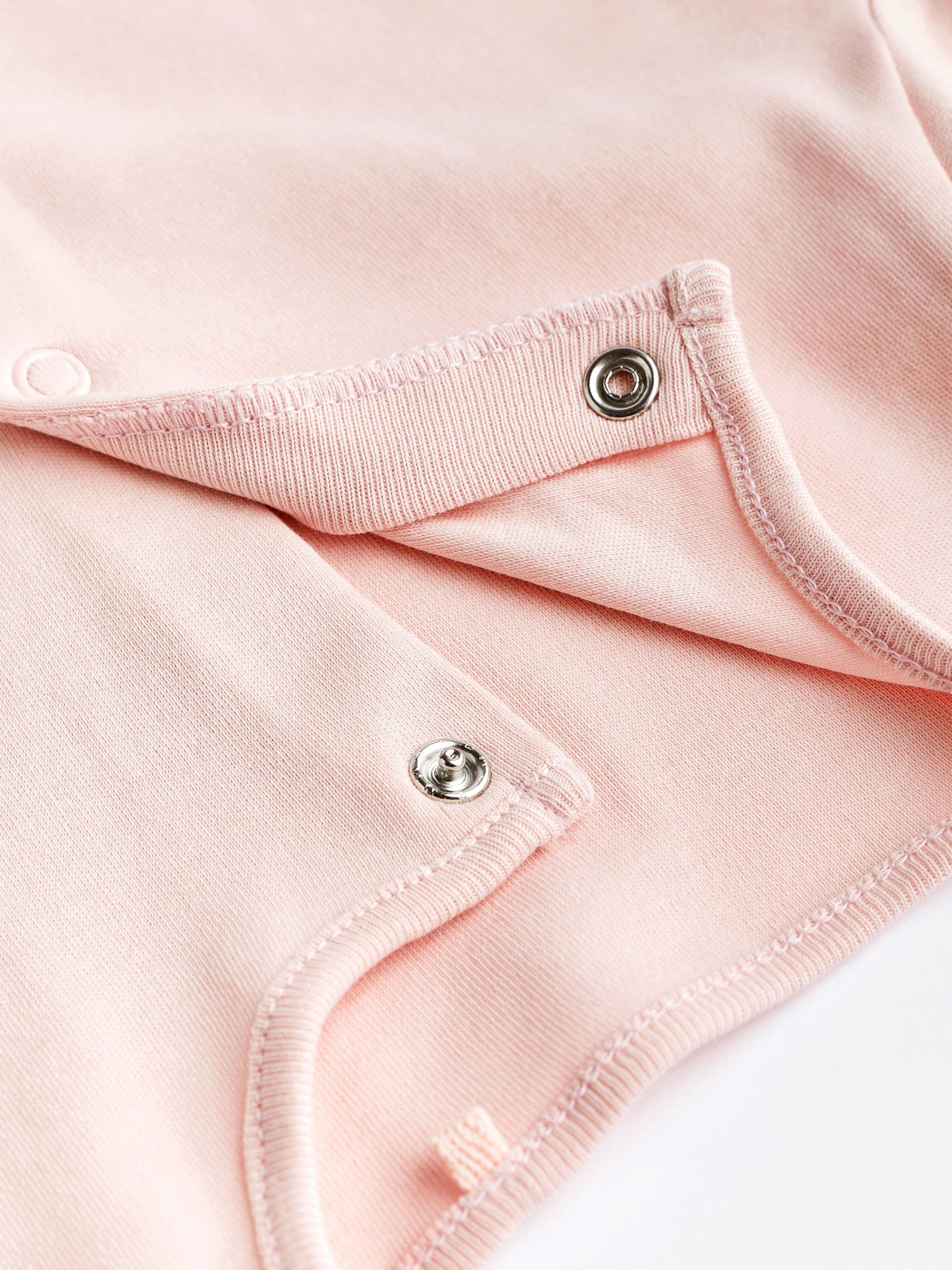 Roze/wit - Babypyjama's (0-2 jr)